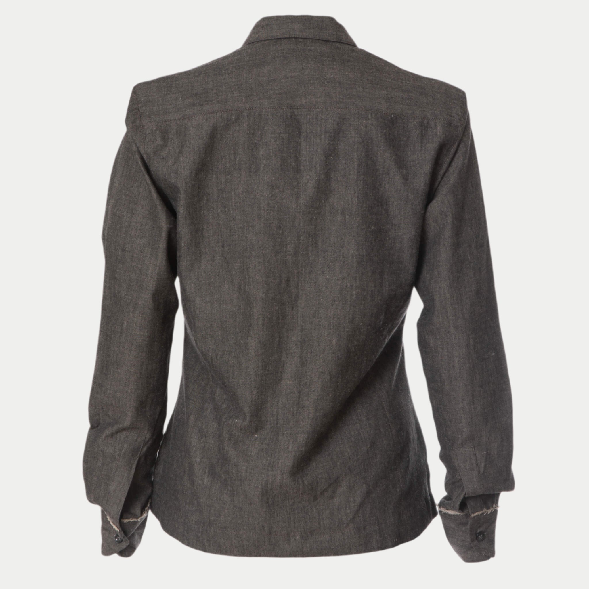 back view of the grey classic updated chemise shirt by inlarkin showing the full length sleeves and raw-edge at cuffs in cotton chambray fabric