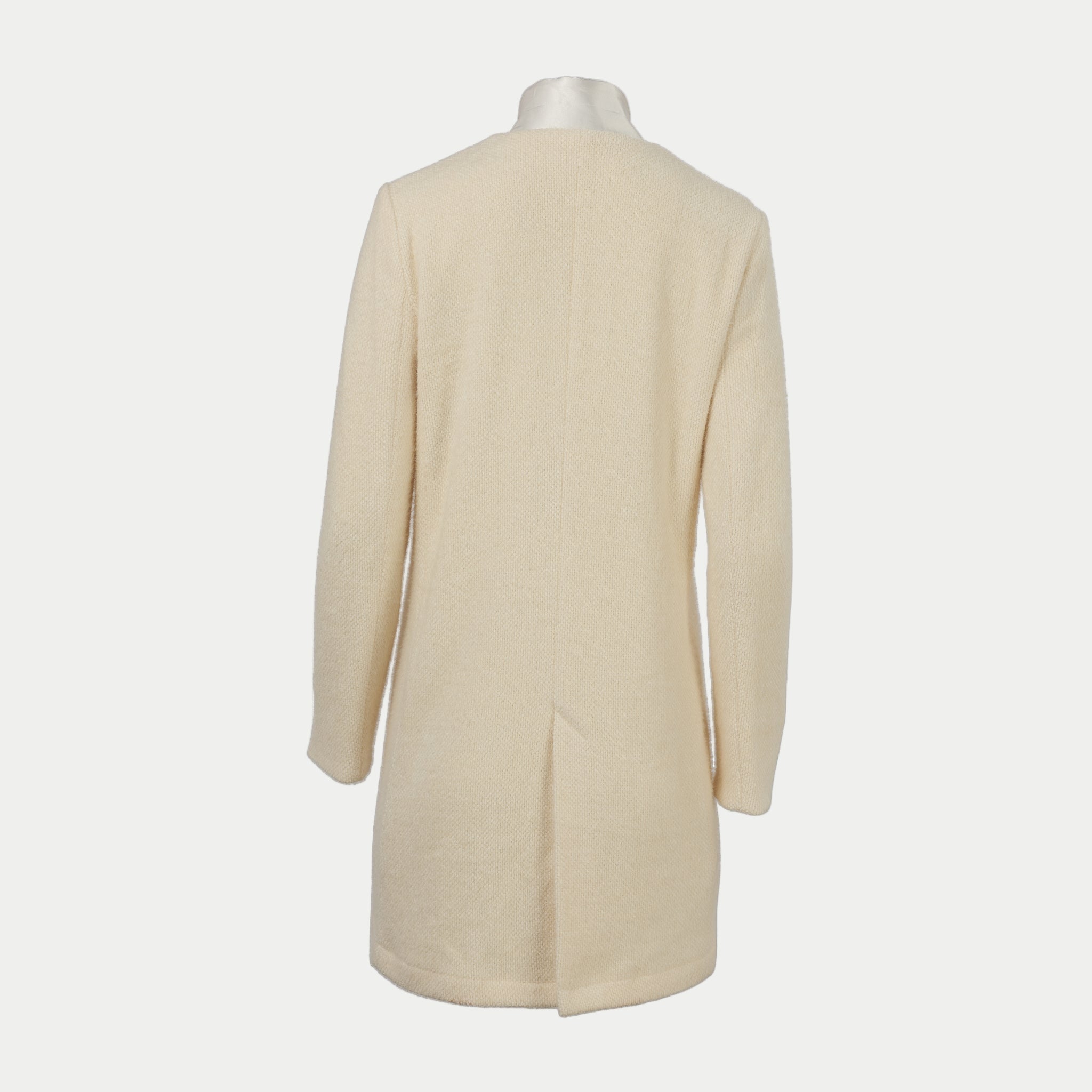 cream colored coat with white collar back view by inlarkin on an off-white background