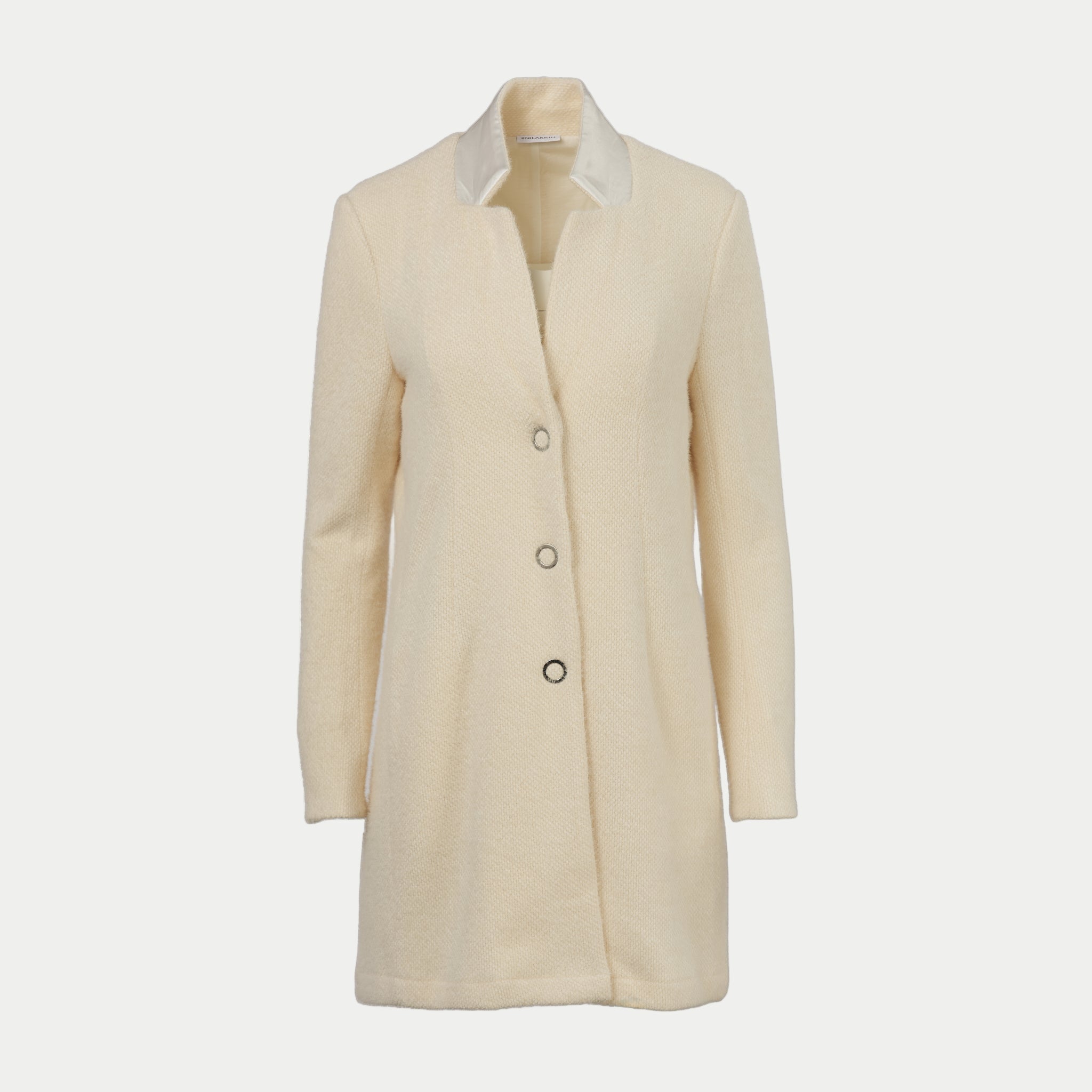 cream colored coat with white collar front view by inlarkin on an off-white background