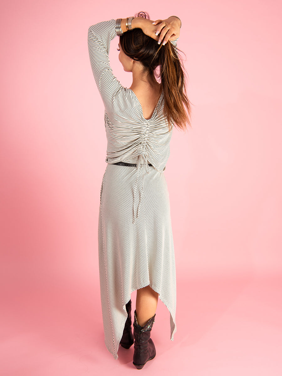 the drunk stripe dress by inlarkin in white stripe with the front knot cardigan in white stripe shown from the back view