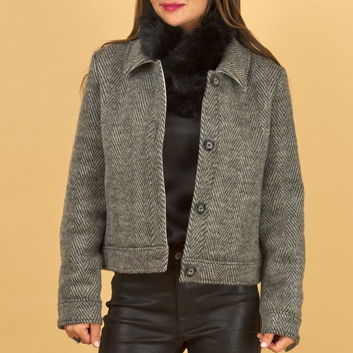 the harriet herringbone jacket in black paired with a black decuir silk shell and curve gloss jean by inlarkin