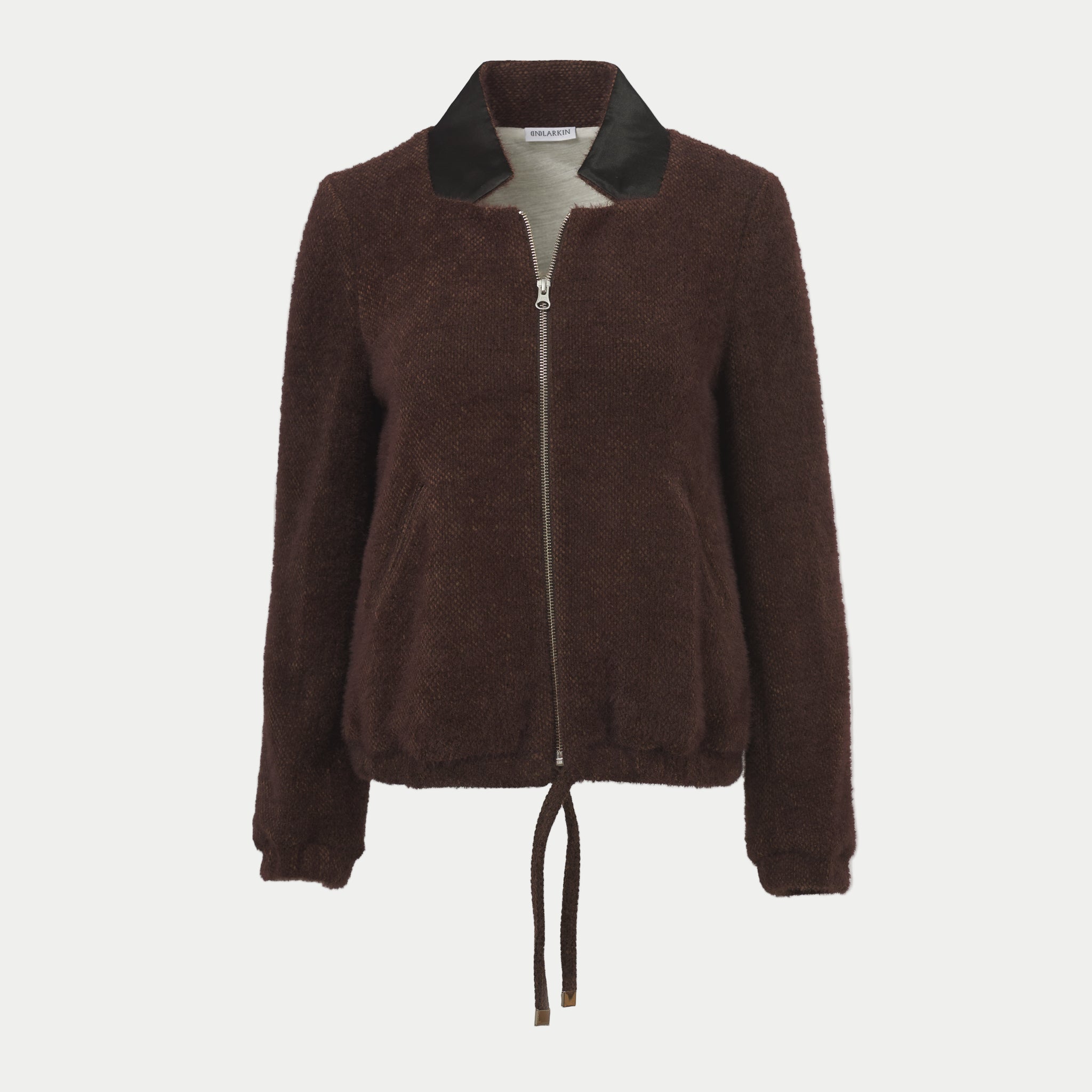 the larkin jacket in chocolate by inlarkin with a zipper front and tie waist on an off-white background
