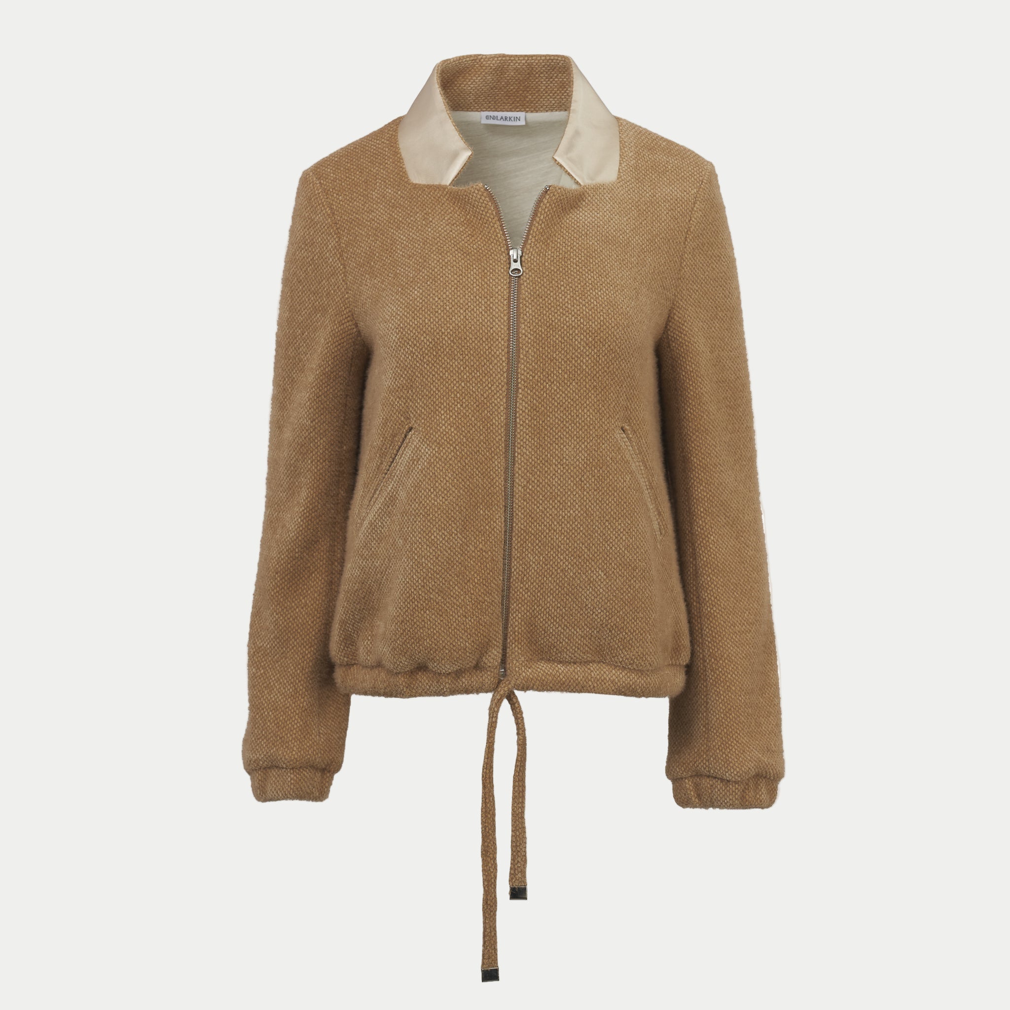 the larkin jacket in fawn by inlarkin with a zipper front and tie waist on an off-white background