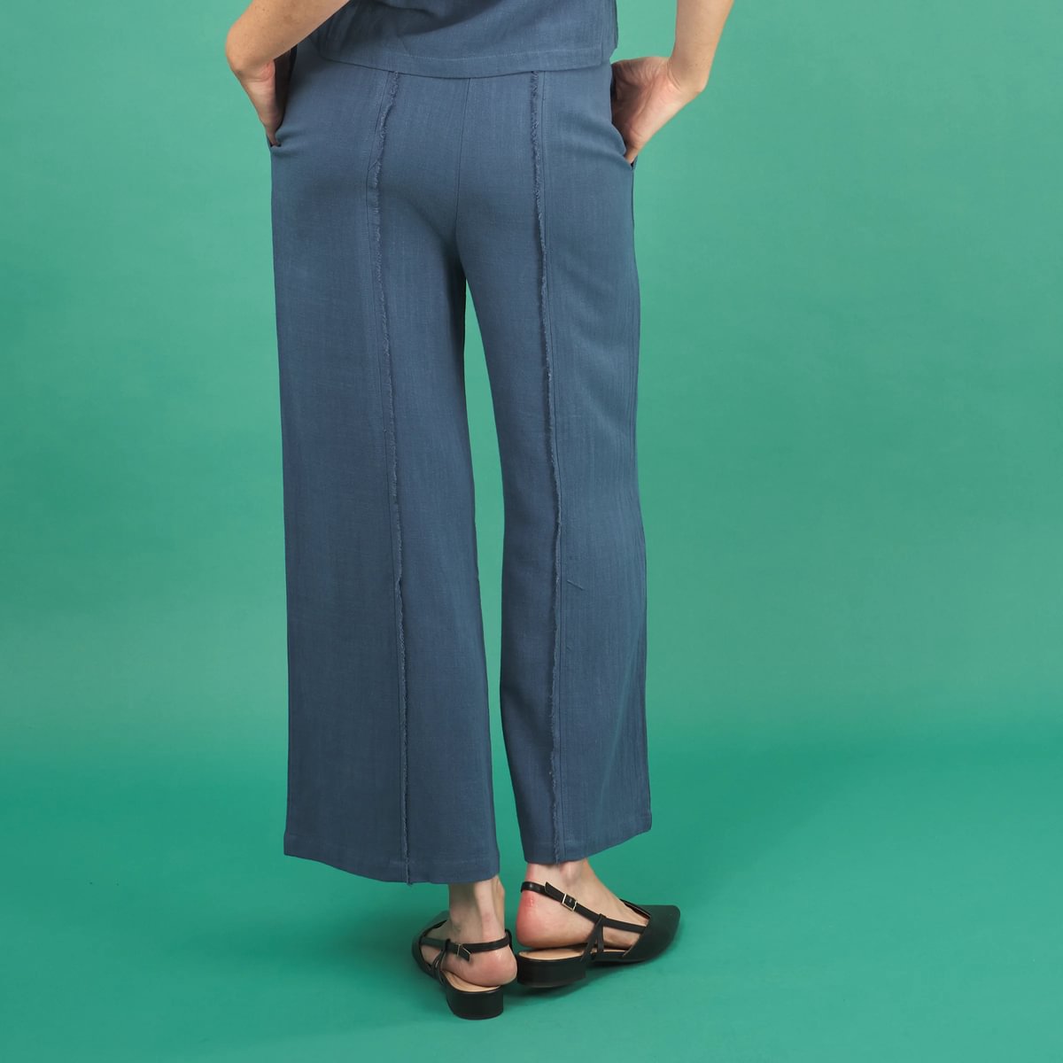 the linen fray pant in french blue back view with frayed seams, and cropped length