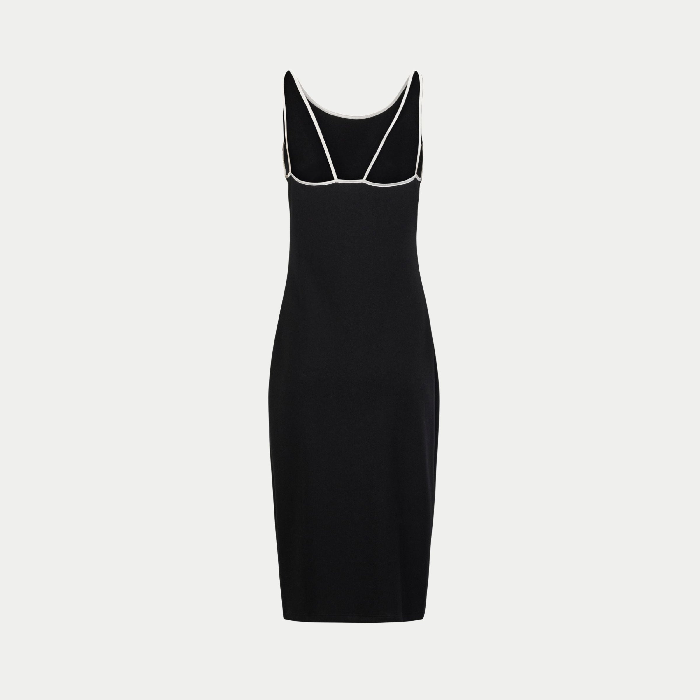 the mariposa dress by inlarkin in black with white straps back view showing the strap detail and body fitting form