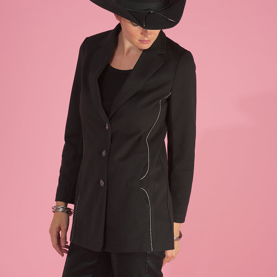 the maxine blazer by inlarkin in black front side view buttoned showing the stylish silver bead trim and pocket detail with large resin buttons with fine silver trim