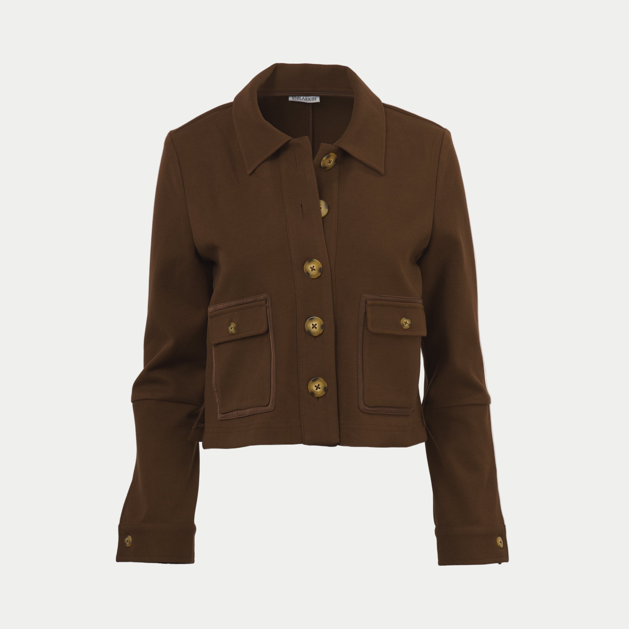 Hot chocolate colored shaket crop jacket by inlarkin with button details on an off-white background