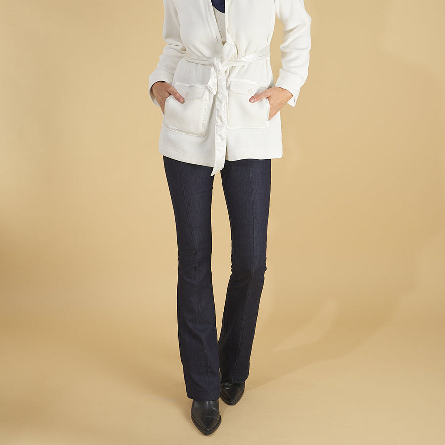 shirt jacket by inlarkin in white front view featuring the front sateen patch pockets, collar and sea glass buttons paired with the sublime jean