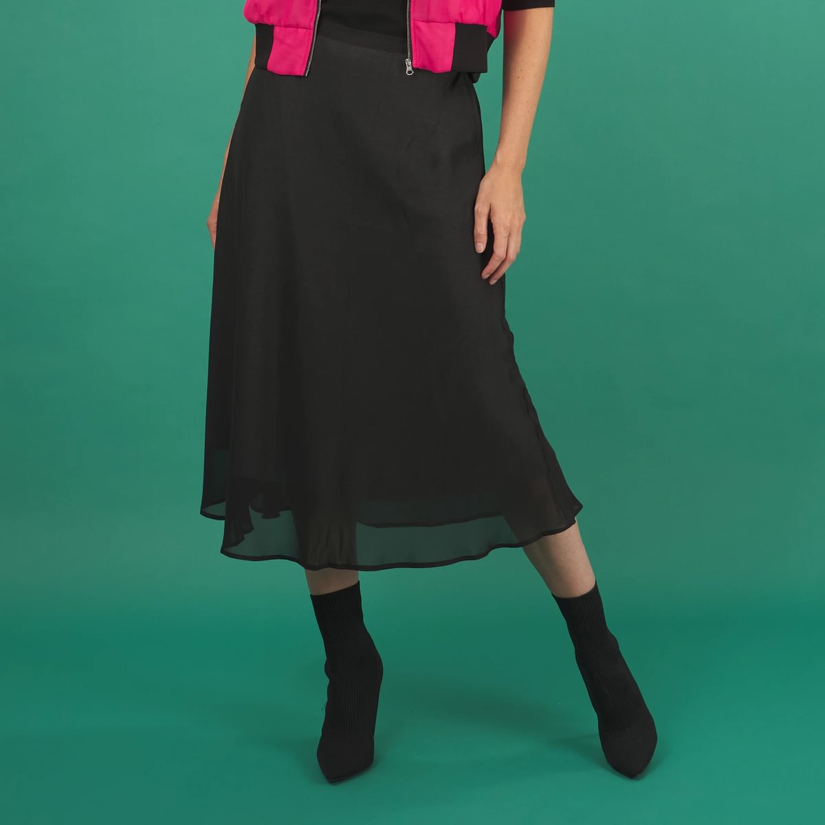 a black midi length slay skirt by inlarkin with a sheer layer at the hem and side pockets