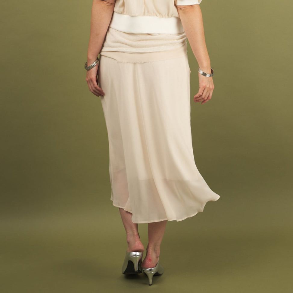 a cream midi length slay skirt by inlarkin back view with a sheer layer at the hem and side pockets