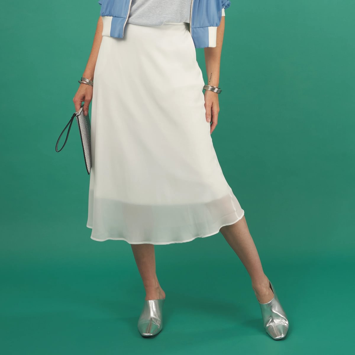 a white midi length slay skirt by inlarkin with a sheer layer at the hem and side pockets