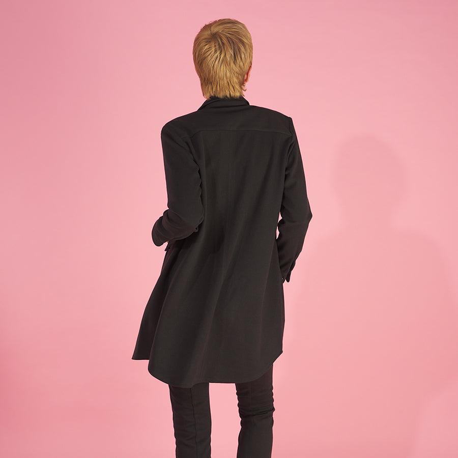the sy shirtdress by inlarkin in black back view detailing the shirt tail