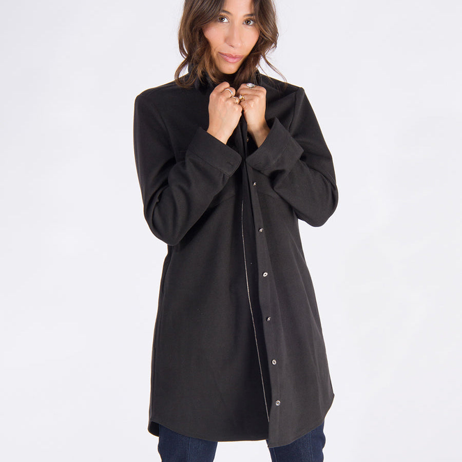 the sy shirtdress by inlarkin in black featuring a silver beaded chain trim, sateen facing, silver peek-a-boo buttons and new felted stretch fabric paired with the sublime jean