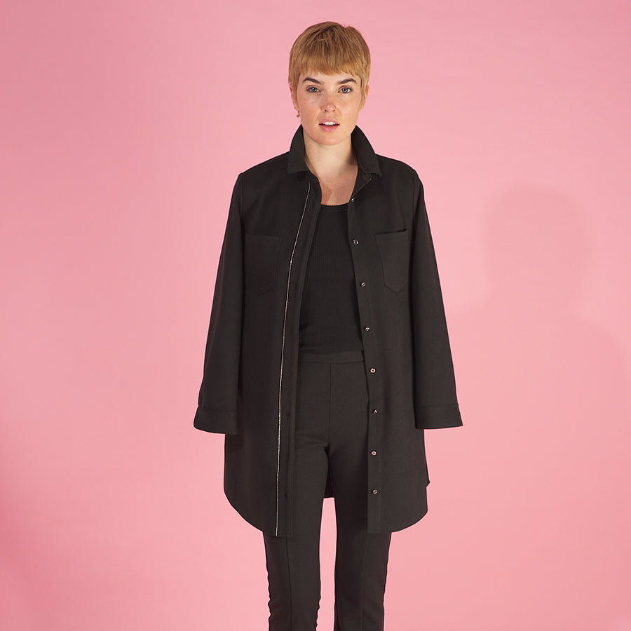 the sy shirtdress by inlarkin in black featuring a silver beaded chain trim, sateen facing, silver peek-a-boo buttons and new felted stretch fabric paired with the sublime pant in black