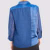 back view of the navy aliferous shirt by inlarkin detailing the back flap of fabric and sheer sleeves