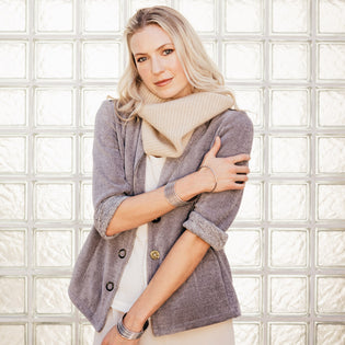  woman wearing inlarkin clothing collection including the michele blazer, cashmere neck warmer and cashmere blend joggers