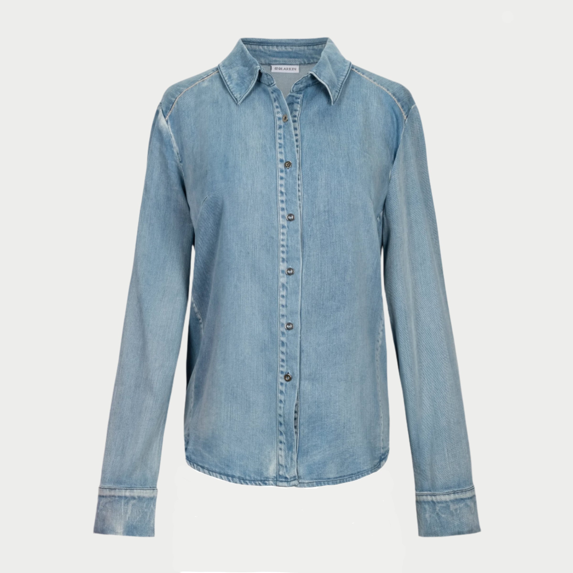 the alex shirt in denim by inlarkin featuring elegant hand beading along the shoulder and cuffs for a casual and polished look