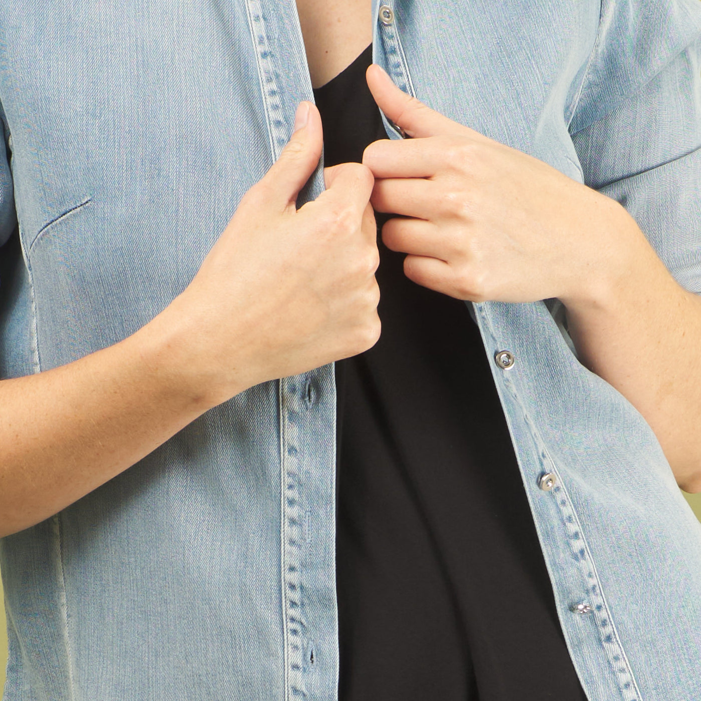 the denim alex shirt front view detail of fabric and baby buttons by inlarkin