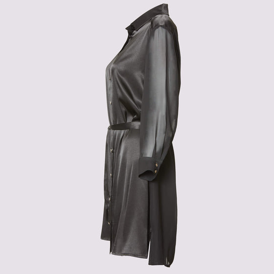 a side view of the aliferous shirt dress in black by inlarkin showing the length and mid thigh and button front closure