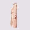 a side view of the aliferous shirt dress in coral by inlarkin showing the length and mid thigh and button front closure