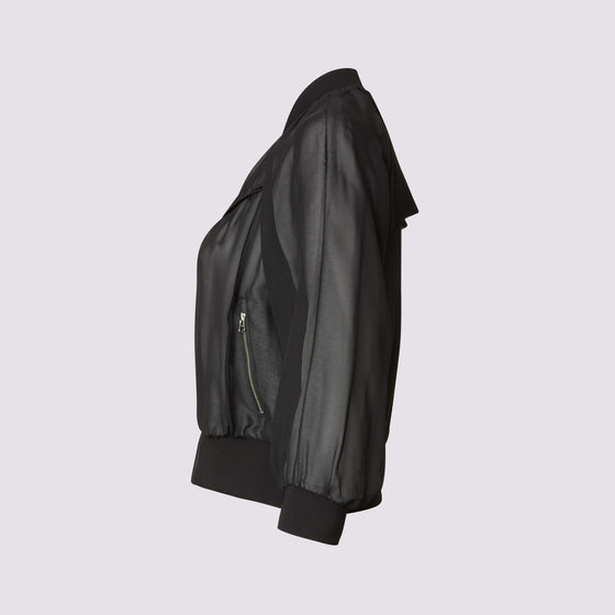 beauty bomber jacket in black by inlarkin side view showing the piping and zipper detail
