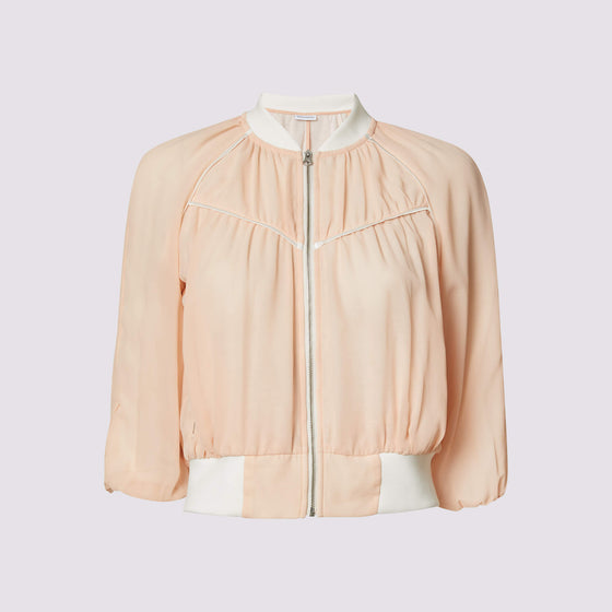 beauty bomber jacket in coral by inlarkin front view showing the piping and zipper detail