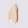 beauty bomber jacket in coral by inlarkin side view showing the piping and zipper detail
