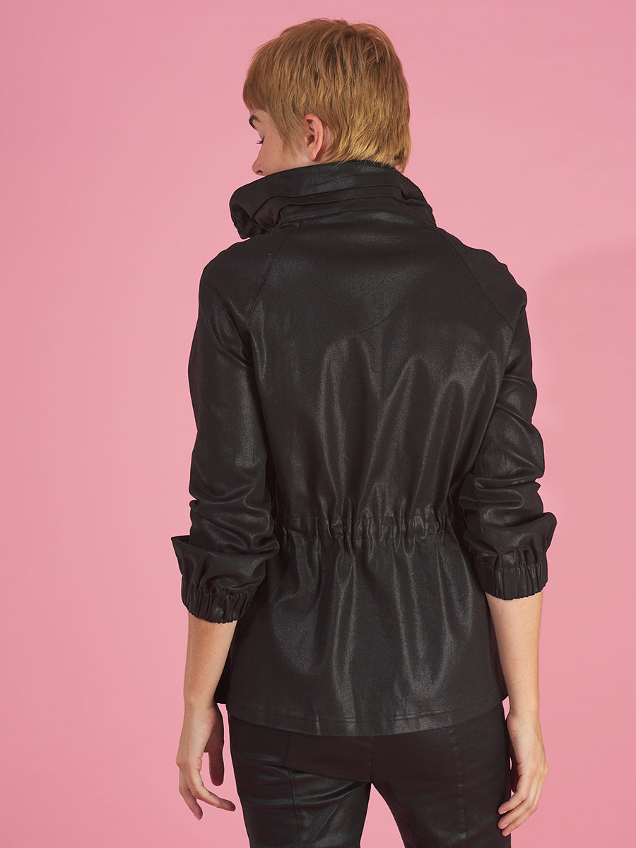 the brooke breaker in black back view by inlarkin with a drawstring waist and ruched drawstring collar 