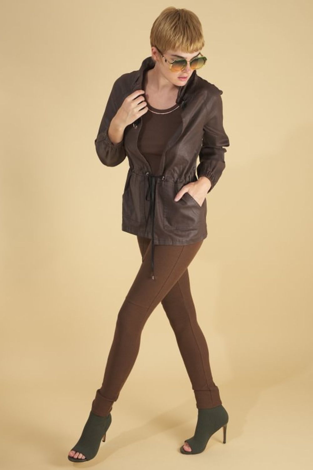 the brooke breaker by inlarkin in chocolate front view showing the ruched collar with drawstrings, waist drawstring and front pockets