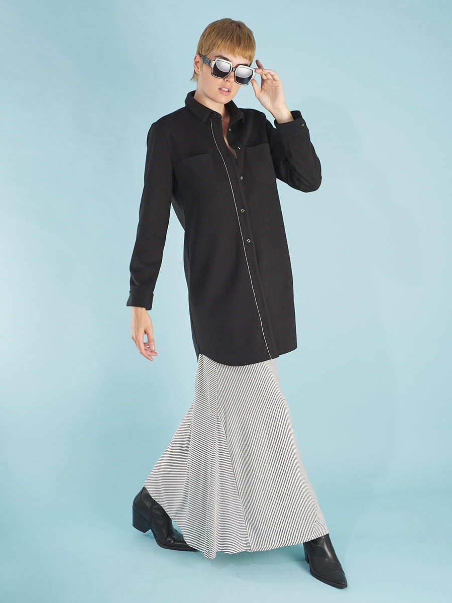 the cody dress in white stripe by inlarkin paired with the black sy shirtdress showing a long lean profile