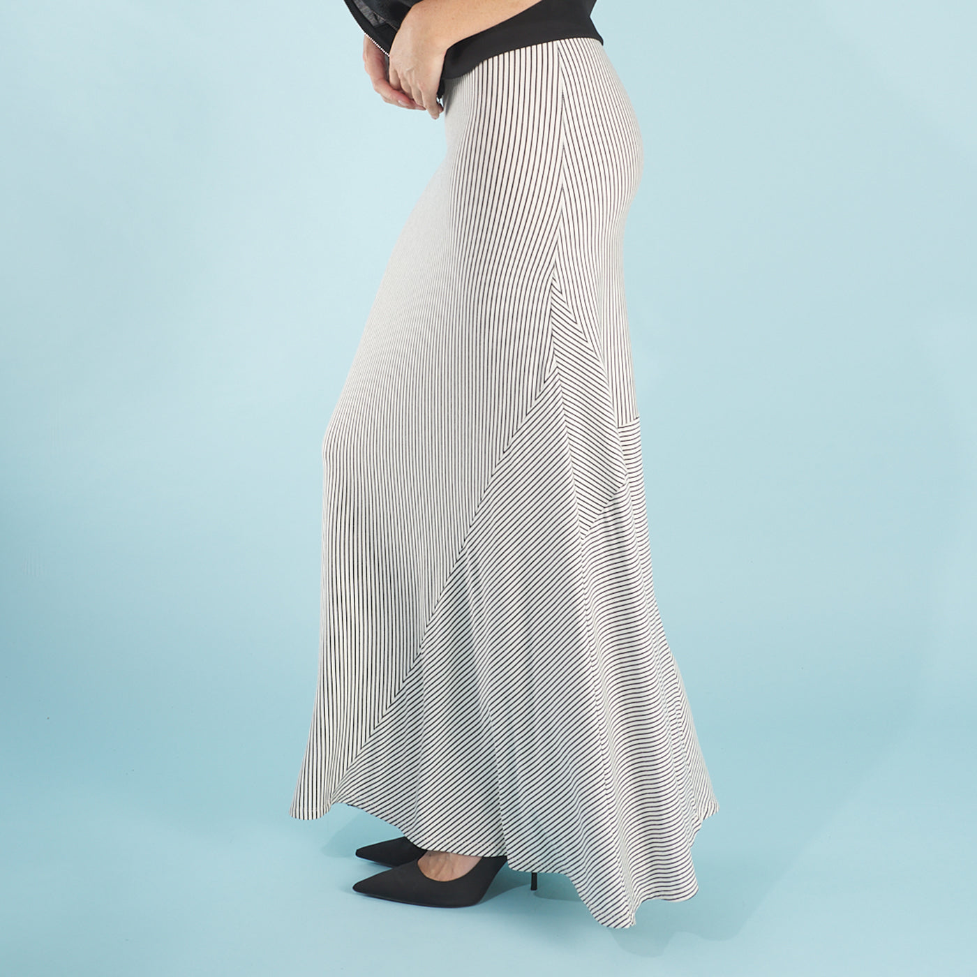 the cody dress in white stripe by inlarkin featuring bias-cut insets at the hem create beautiful movement