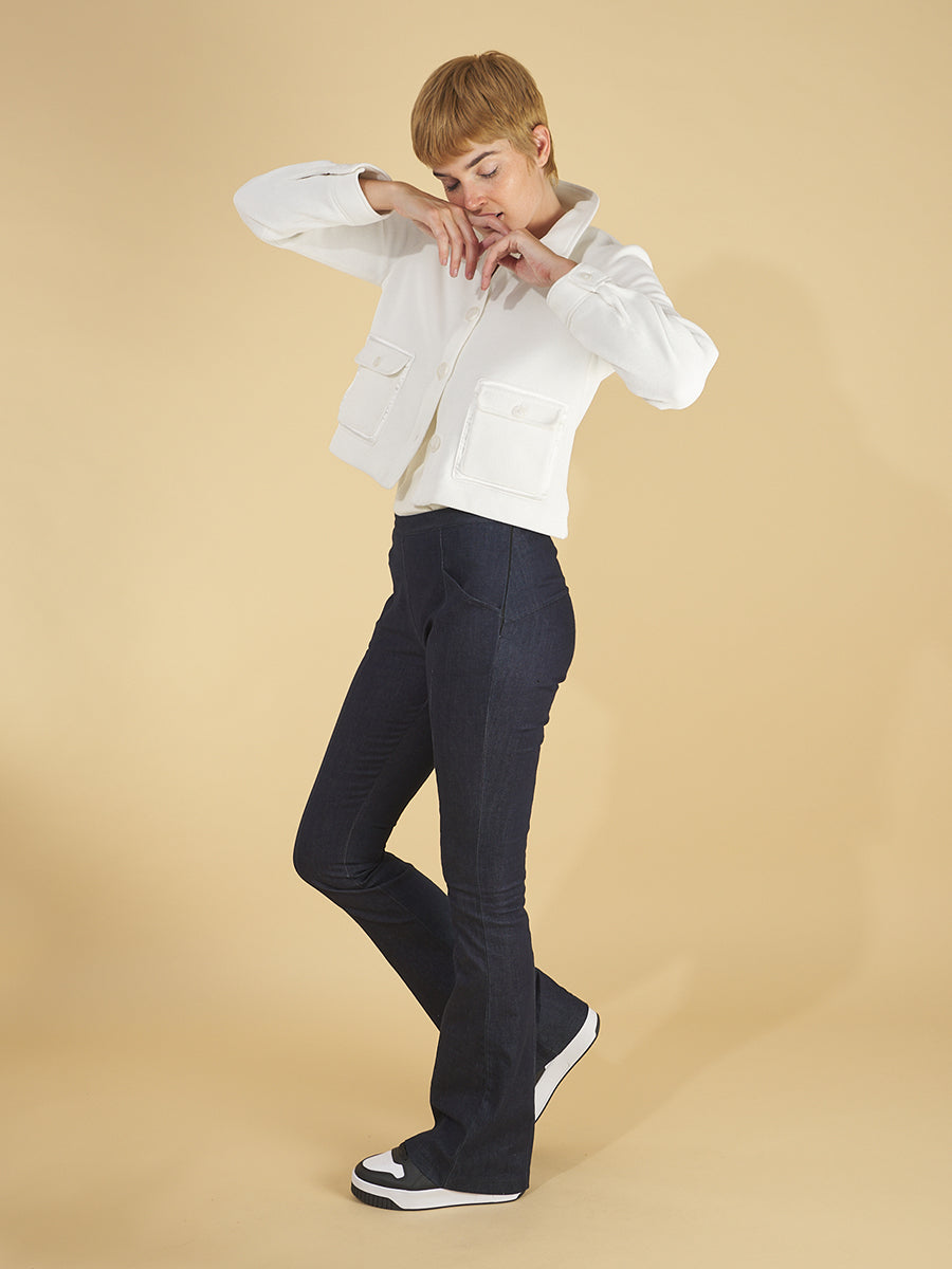 the cropped shirt jacket in white with the sublime jean in indigo by inlarkin showing the versatility of being able to wear the outfit with sneakers or stilettos