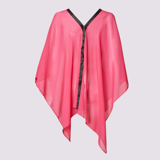 the dottie coverall short by inlarkin in fuchsia with contrasting black satin trim and baby silver buttons is a versatile caftan that has multiply styling options