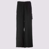 front view of the duster pant in black by inlarkin showing the tie waistband and fringe seams dow the front of the pant