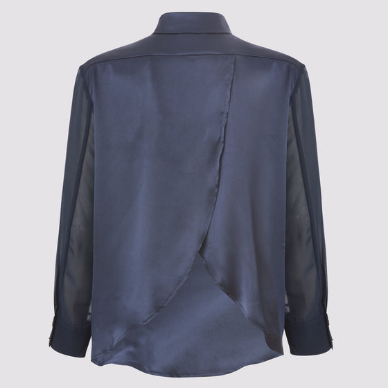back view of the flight shirt by inlarkin in navy showing the wing detail and contrast sheer sleeves