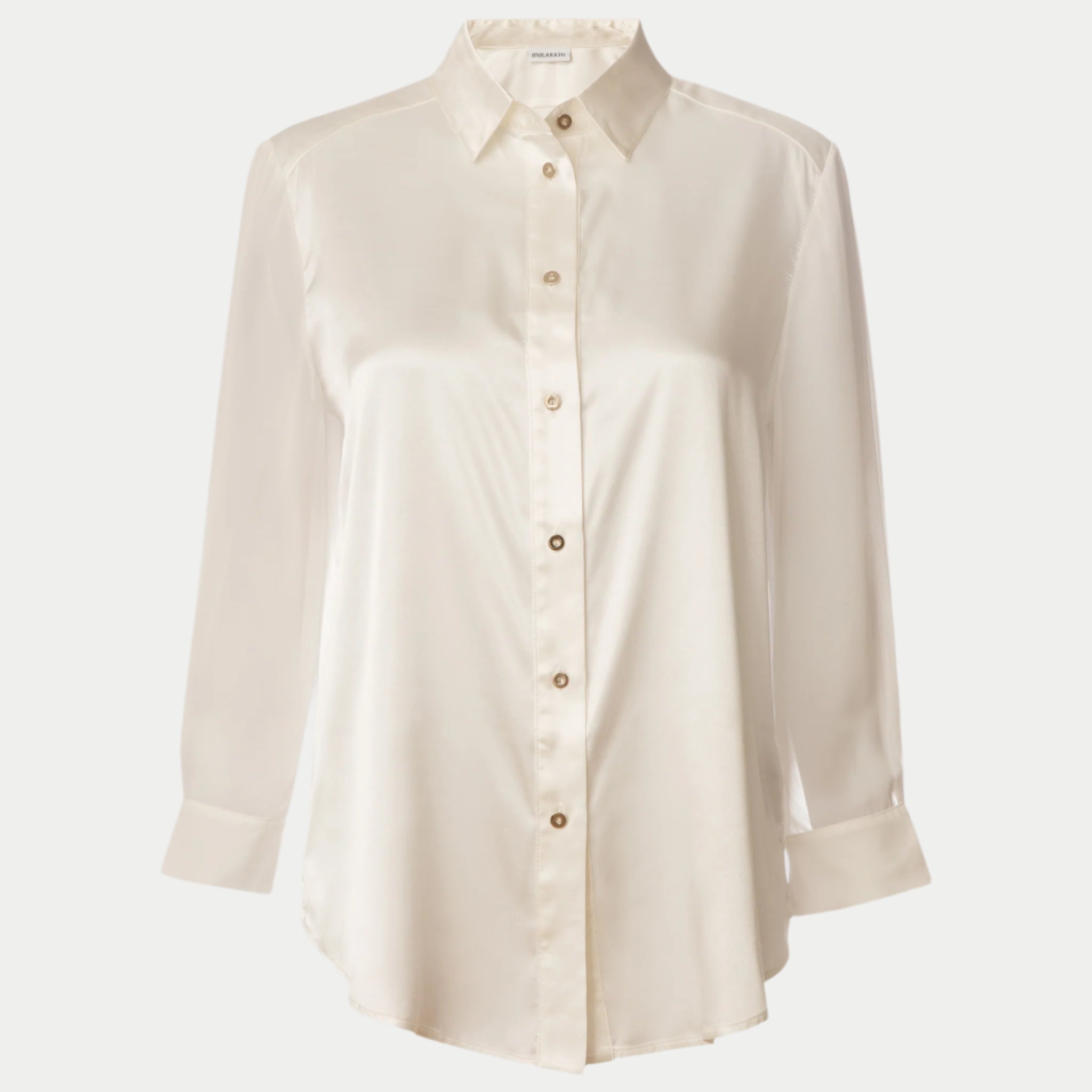 front view of the flight shirt by inlarkin in white showing the sheer sleeves and button detail