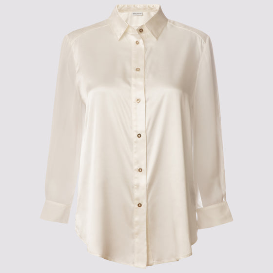 front view of the flight shirt by inlarkin in white showing the sheer sleeves and button detail