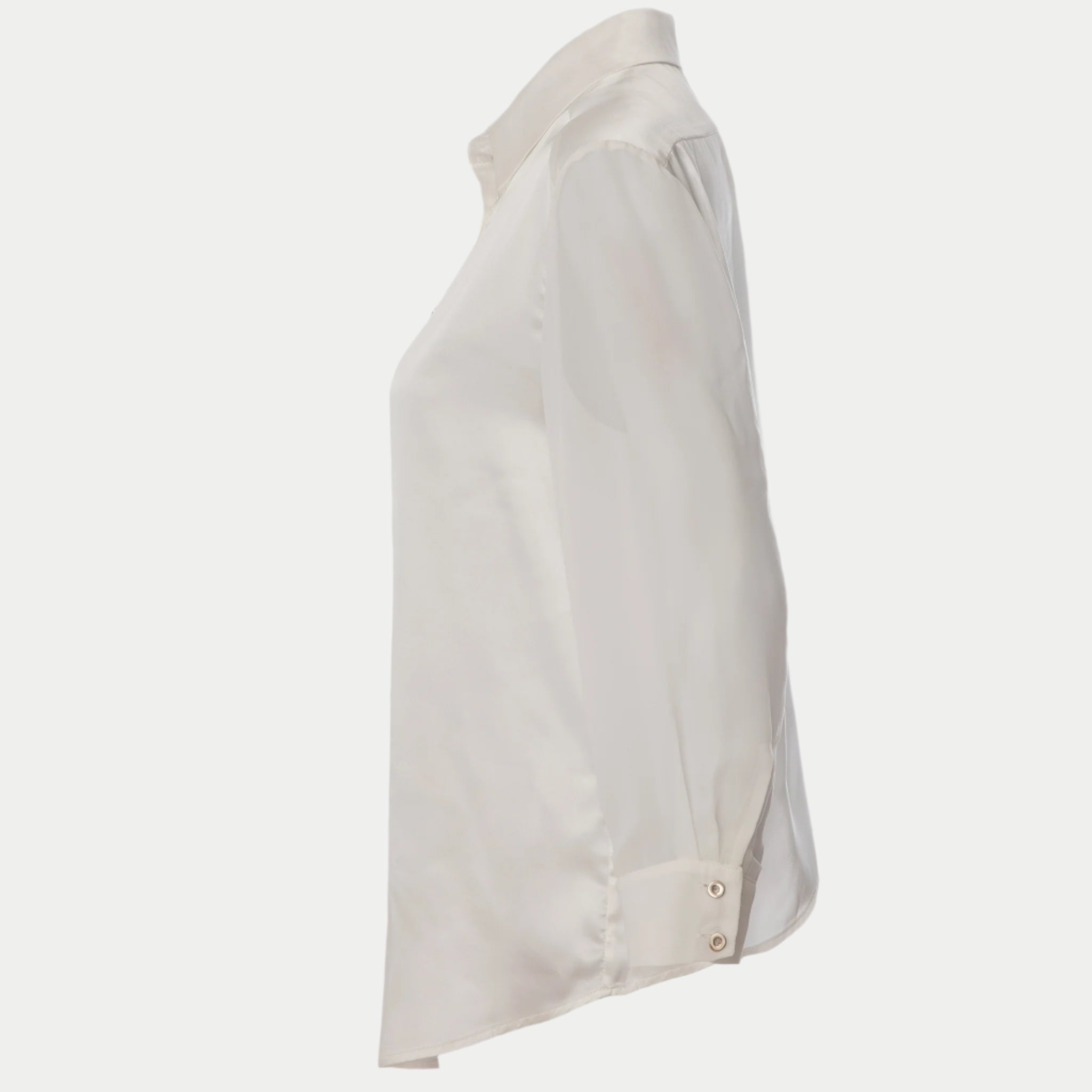 side view of the flight shirt by inlarkin in white showing the sheer sleeves and button detail at sleeve