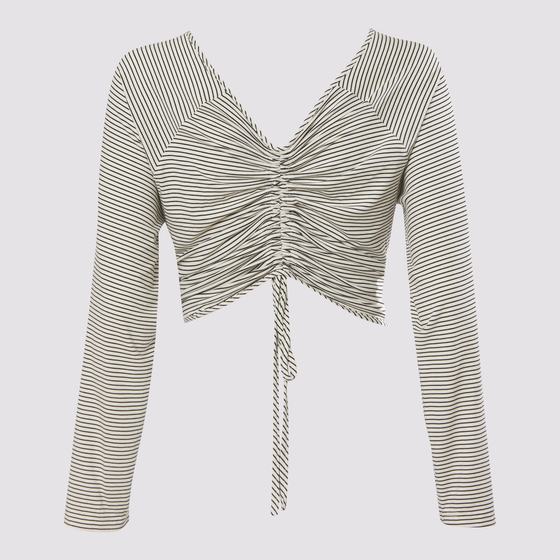 front knot cardigan in white by inlarkin showing the directional striped fabric, raglan sleeves and seam casing of the back