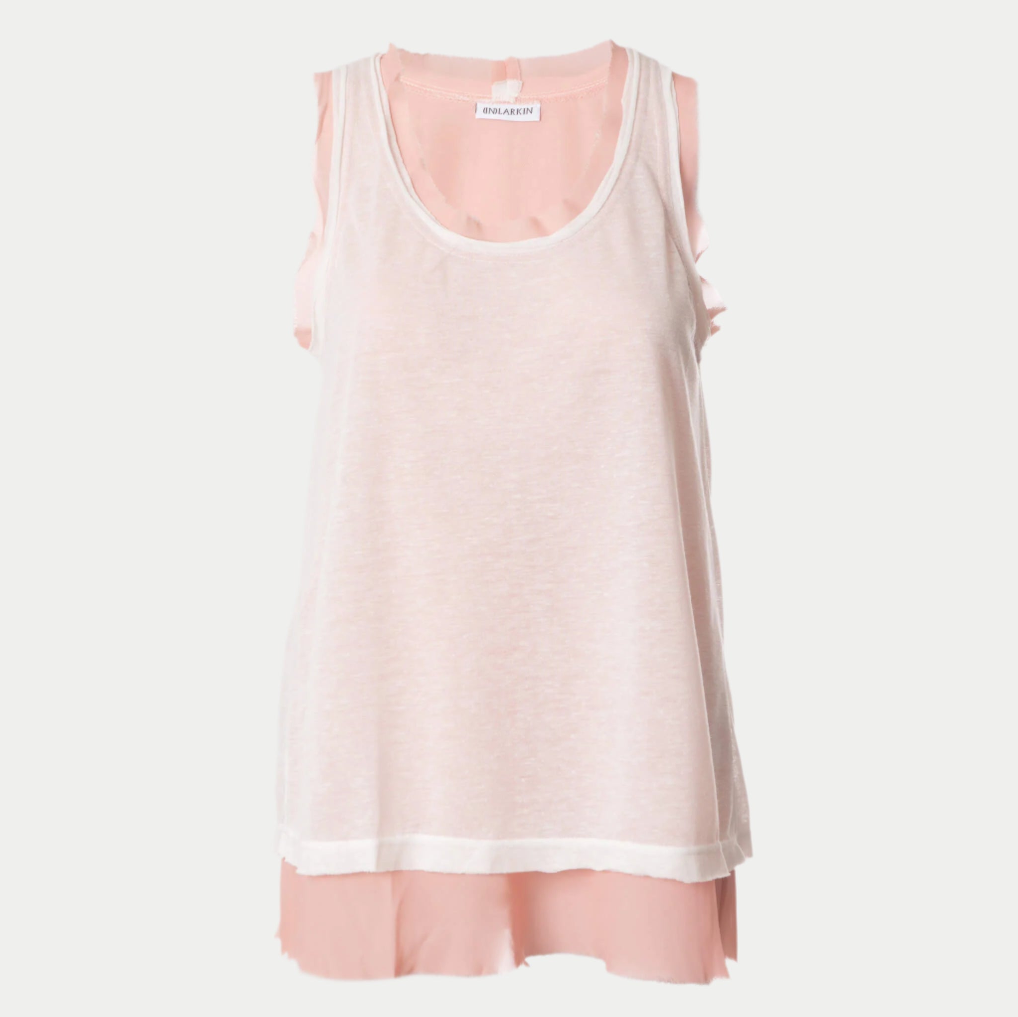 front view of the glasswing shell 2.0 in coral by inlarkin showing the detailed raw edge hem at neckline and arm holes