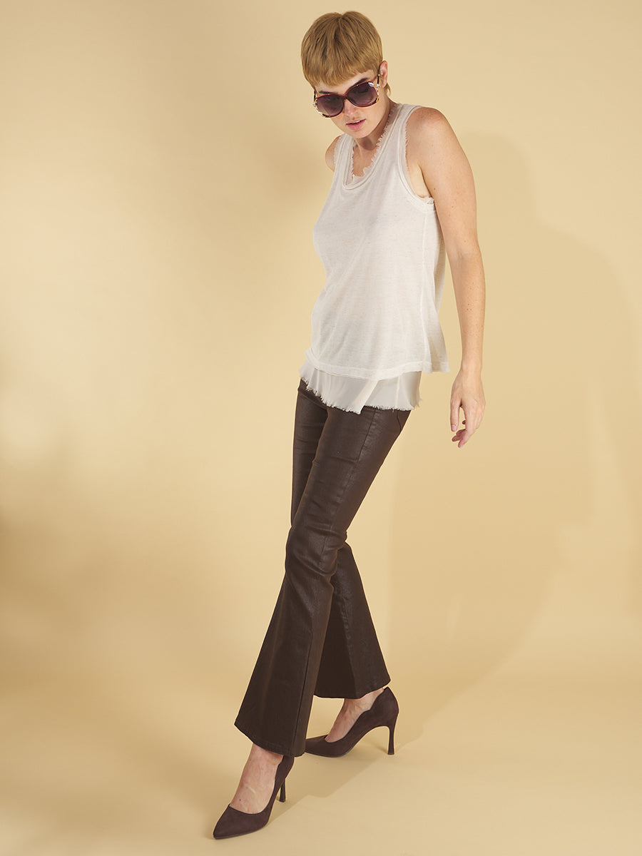 glasswing shell 2.0 by inlarkin in white side view featuring the raw edge hem and double layer tissue construction paired with the gloss bootleg in chocolate featuring the gloss twill fabric and bootleg flare