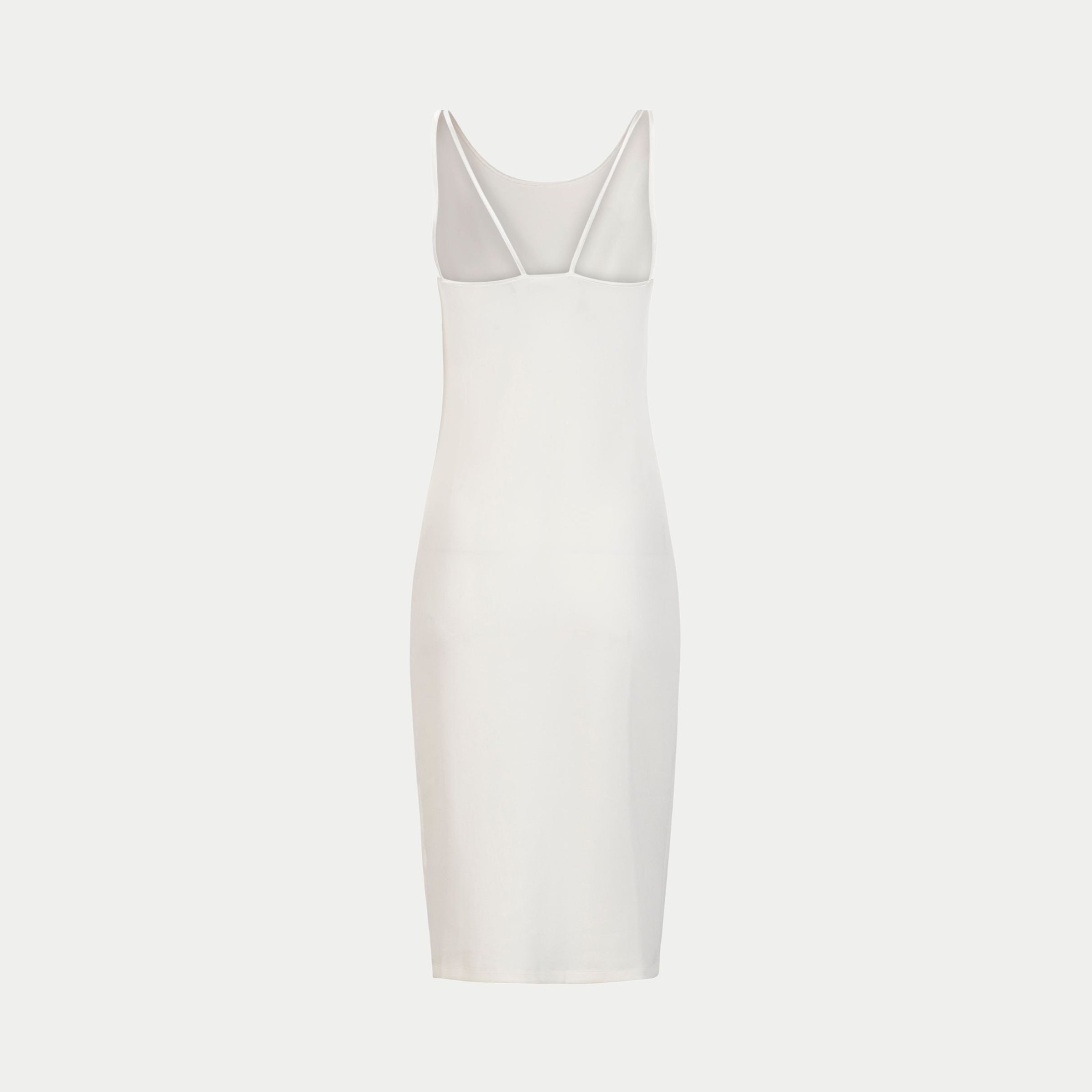 the mariposa dress by inlarkin in white back view showing the strap detail and body fitting form