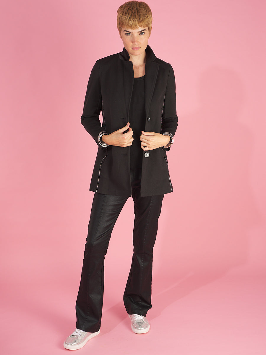 the maxine blazer by inlarkin in black front unbuttoned view showing the stylish silver bead trim and pocket detail with large resin buttons with fine silver trim