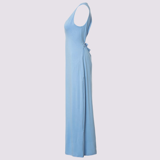 side view of the royal tuck dress in sky blue by inlarkin showing the side seam pocket and drawstring at the back