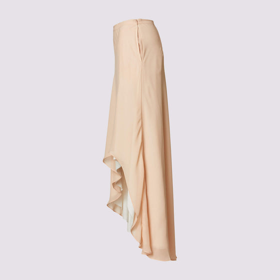 The shay skirt in coral by inlarkin featuring a double layer asymmetrical silo hem