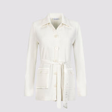  hirt jacket front view in white by inlarkin showing the oversized sea glass buttons, sateen facing collar and belt, and oversized patch pocket with sateen trim