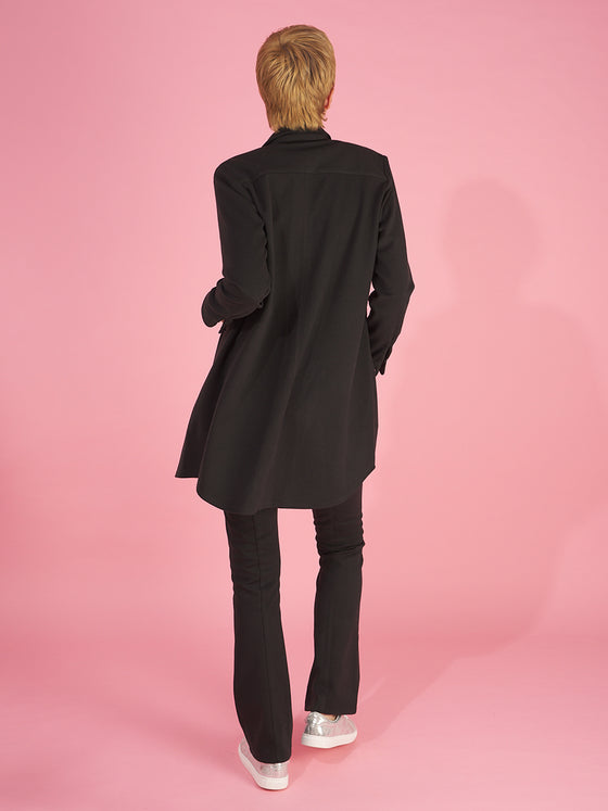 the sy shirtdress by inlarkin in black back view detailing the shirt tail