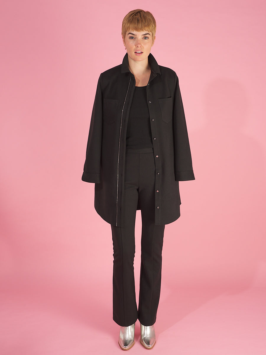 the sy shirtdress by inlarkin in black featuring a silver beaded chain trim, sateen facing, silver peek-a-boo buttons and new felted stretch fabric paired with the sublime pant in black