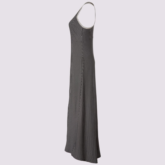 side view of the wingspan dress 2.0 in black by inlarkin showing the directional stripe detail, pockets and armhole contrast detail