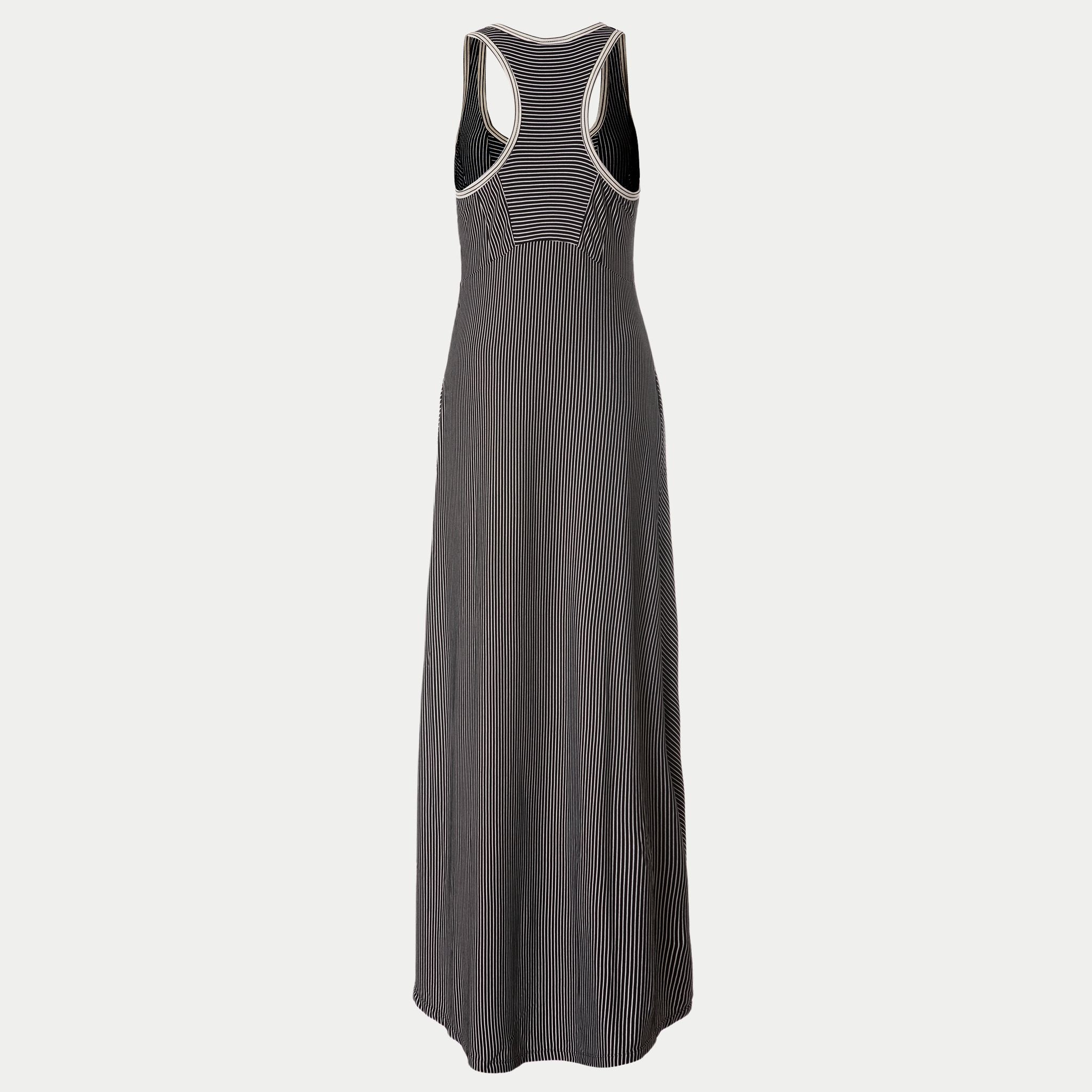 back view of the wingspan dress 2.0 in black by inlarkin showing the directional stripe detail, pockets and  empire top princess seams